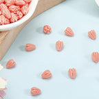 100Pcs 7x9mm Hawaii Flower Beads Carved Coral Beads Summer Pink Jasmine Artificial Floral Synthetic Coral Small Smooth Loose Spacers Findings for Jewelry Making Bracelets Necklaces DIY Crafts