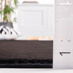 SAFAVIEH Washable Rug Faux Rabbit Fur Shag Collection - 5' x 7', Black, Slip Resistant & Easy Cleaning, Ideal for Living Room, Bedroom, Kids Playroom, Nursery, Dining Space (FRF100Z)